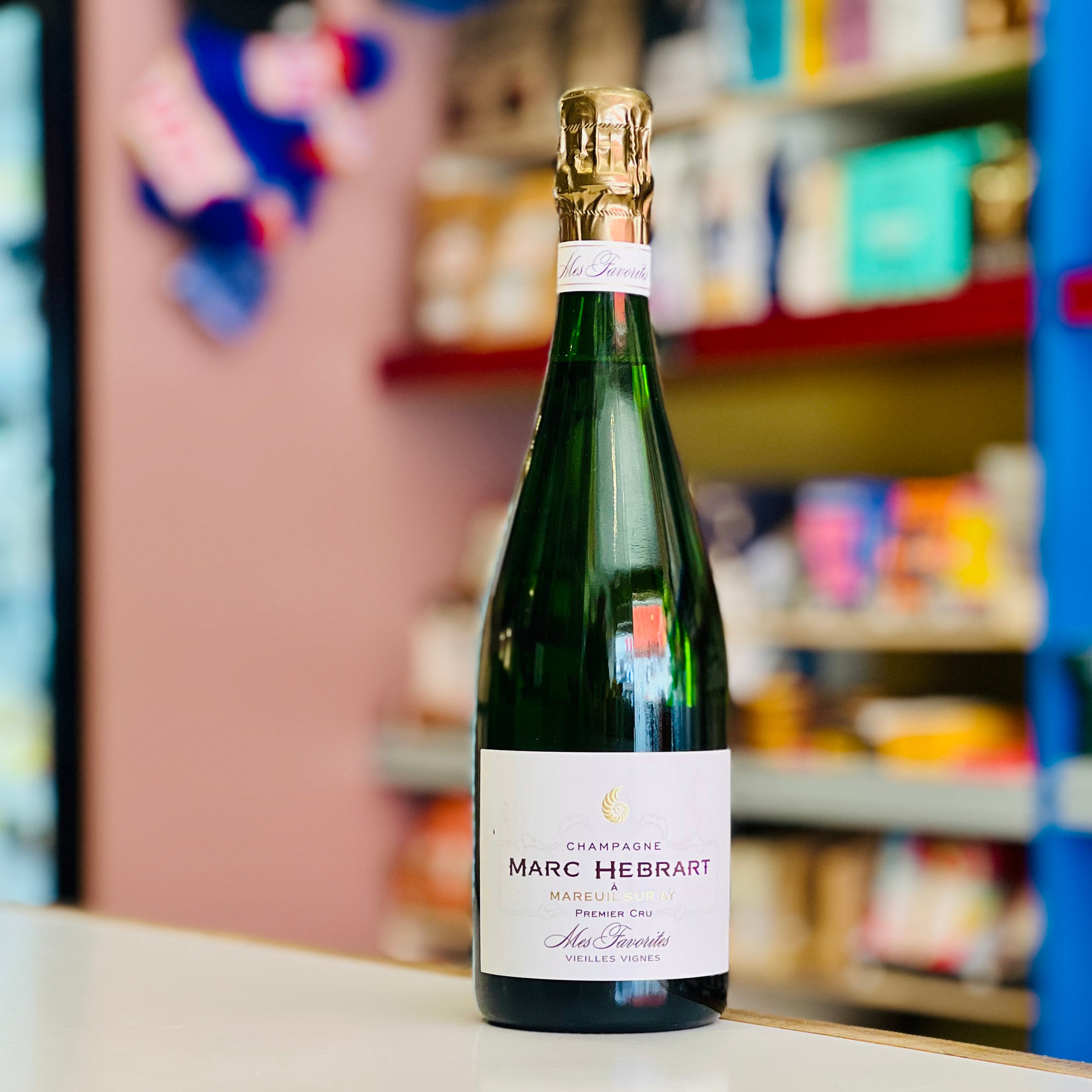 Bottle of Marc Hebrart champagne on a shelf in a store