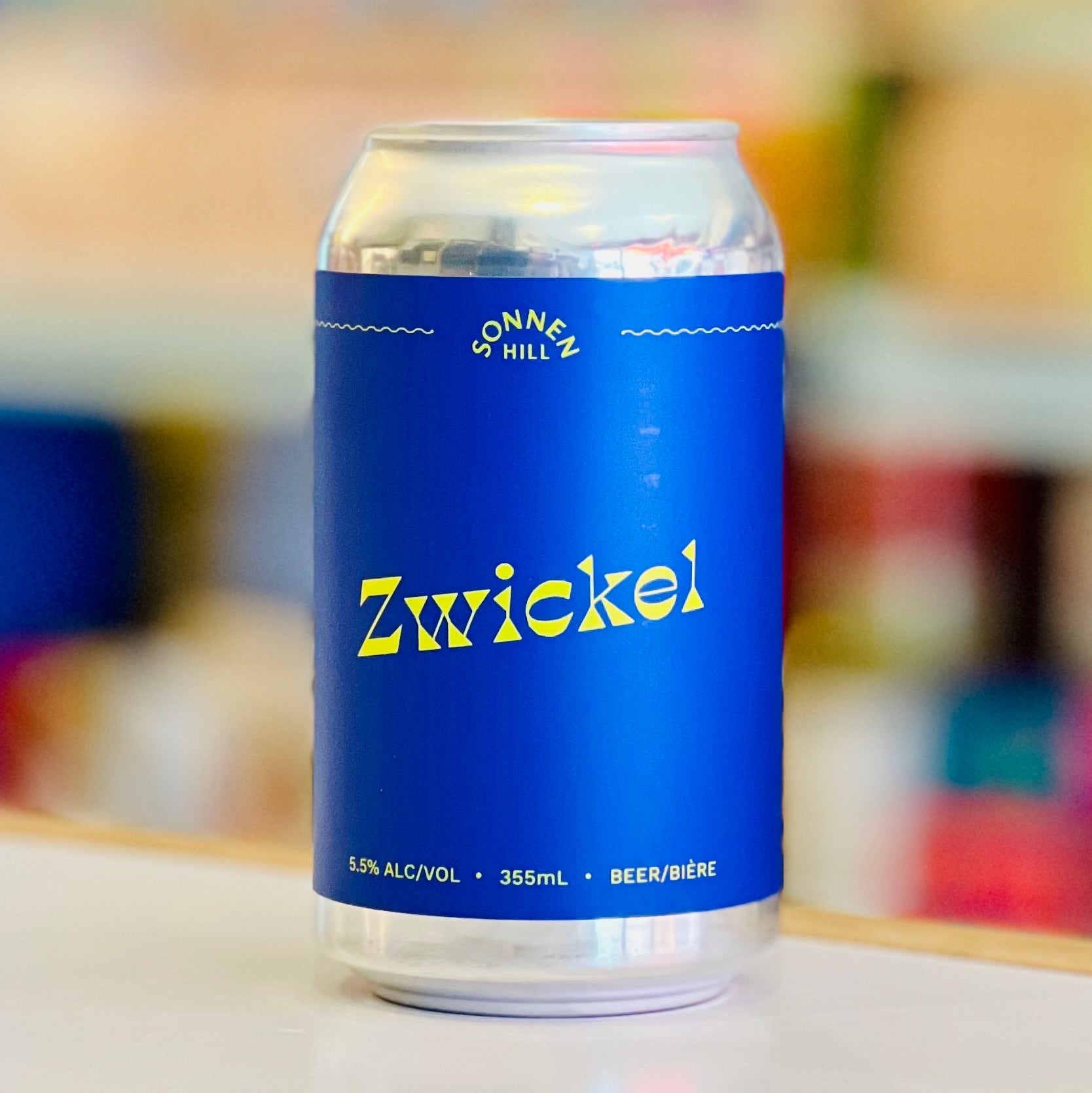 Blue can of Zwickel beer with a blurred background