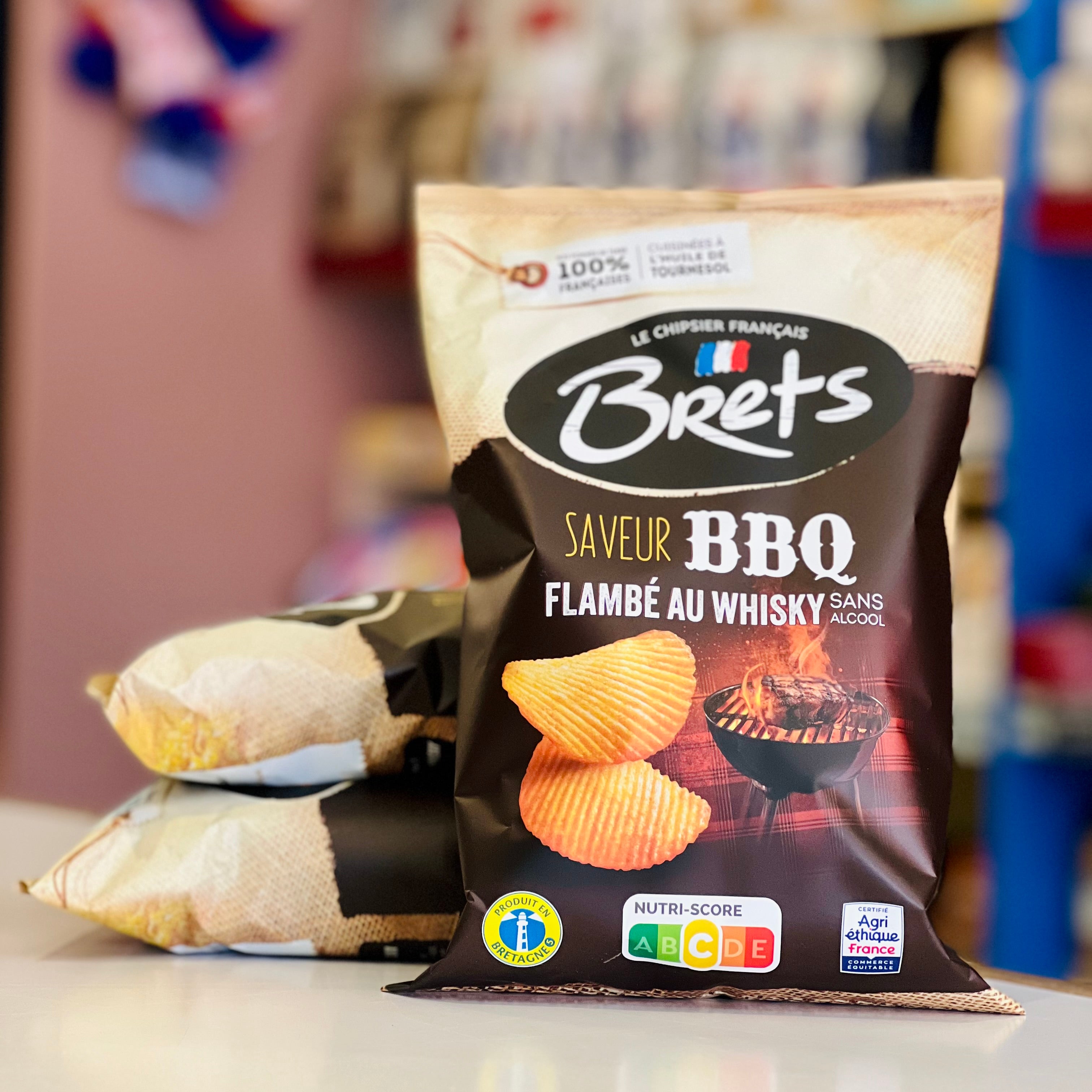 Bag of Bret's BBQ flavored chips with a blurred store background