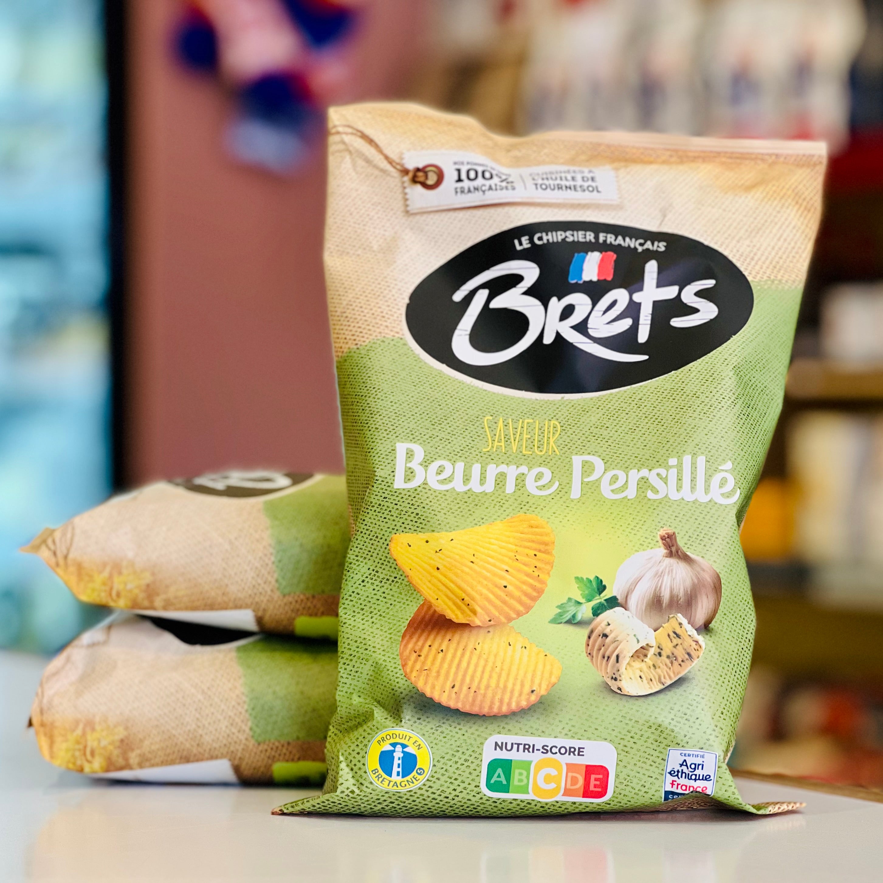 Packaged chips with 'Brets' branding on a blurred background