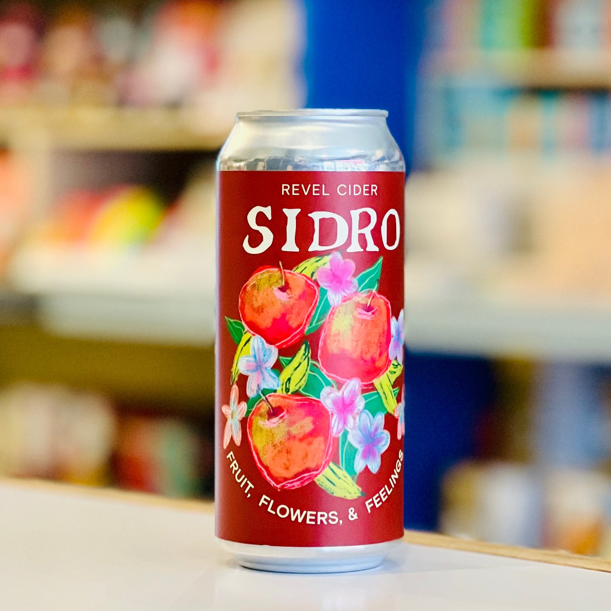 Sidro can with fruit illustration on a store shelf background