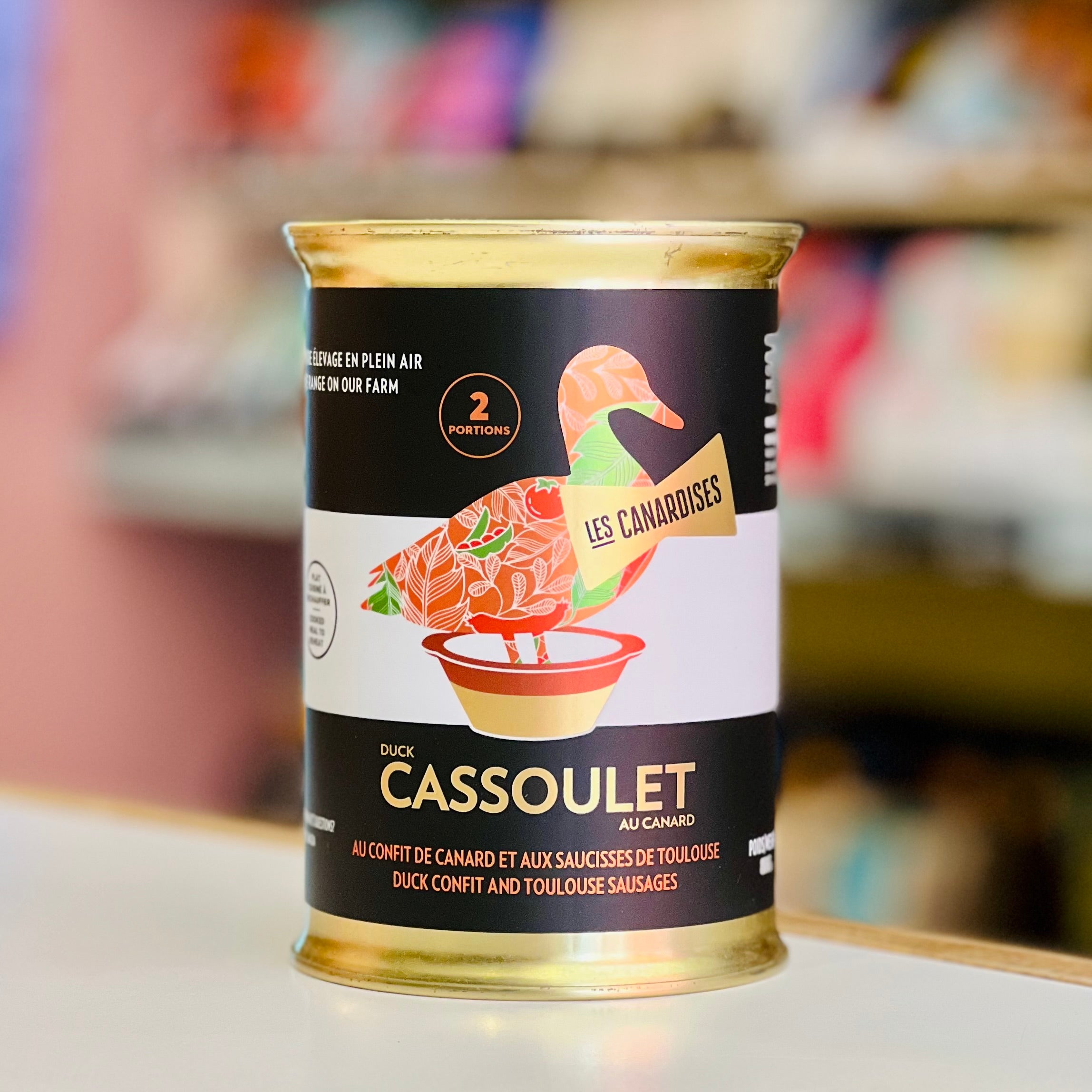 Can of duck cassoulet with a brand logo on a blurred background