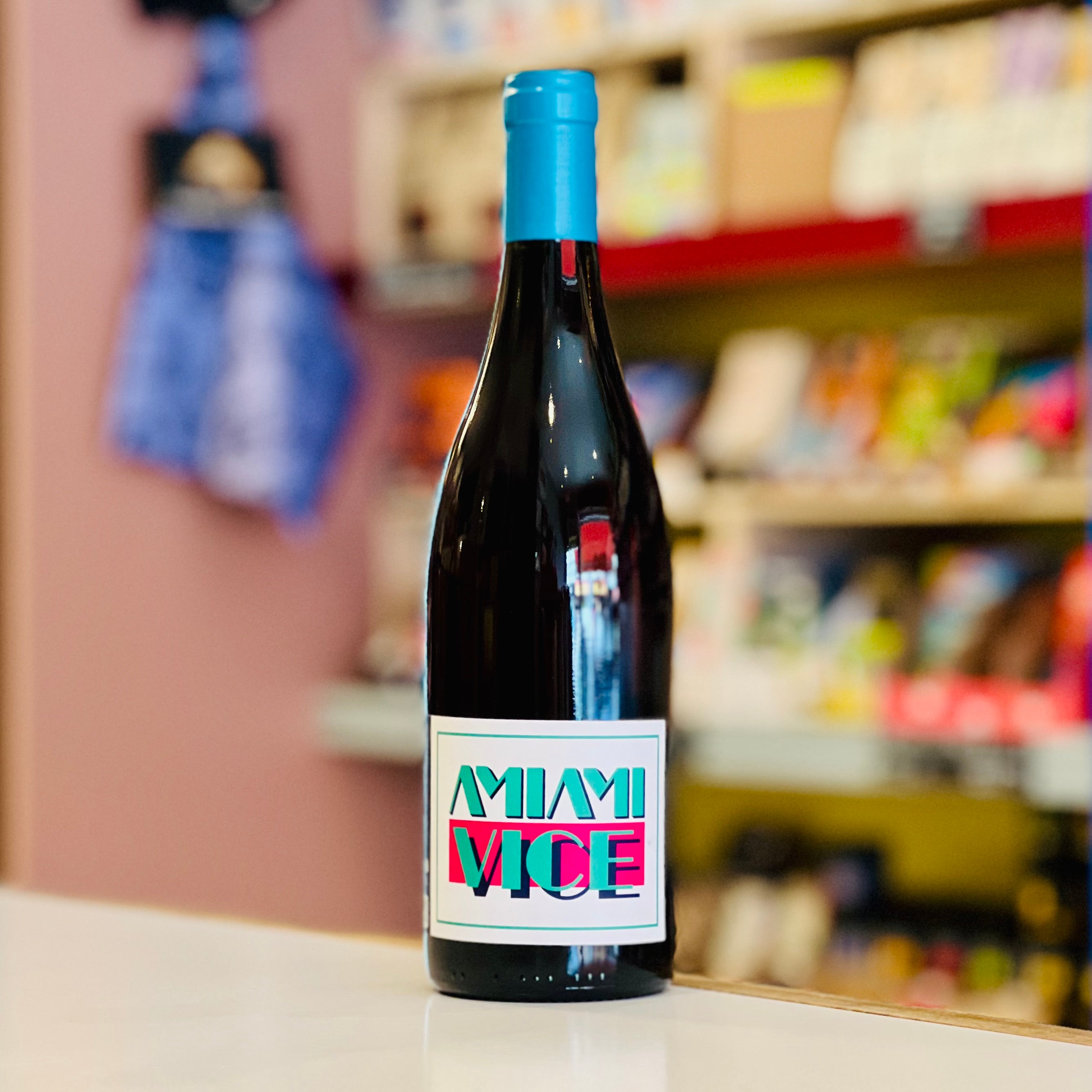 Bottle of wine with a colorful label in a store setting