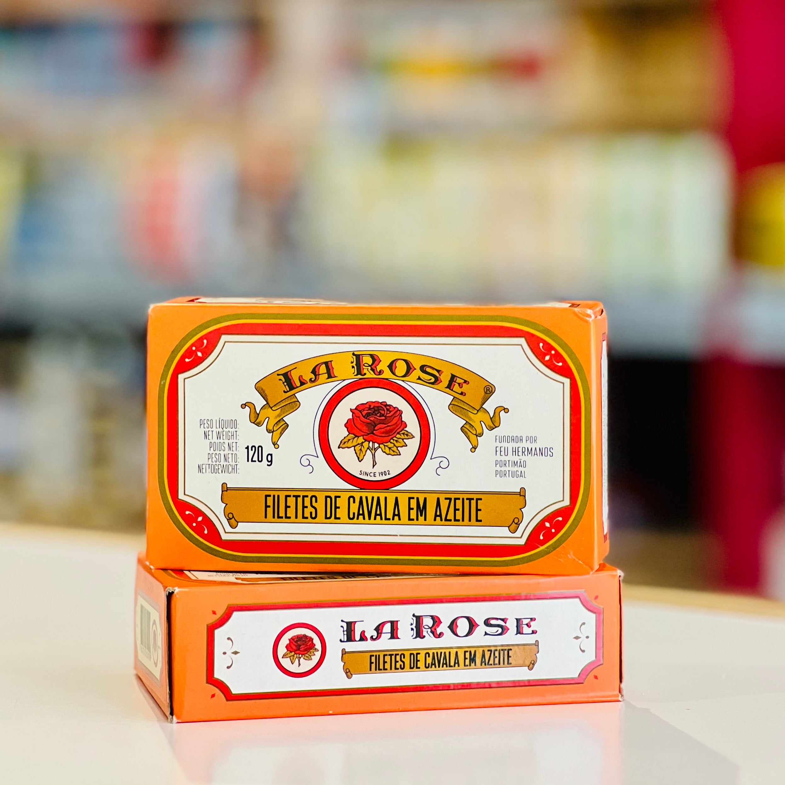 Two boxes of La Rose Filetes de Cavaleta en Azoteje stacked on a white counter, with a blurred retail store background.