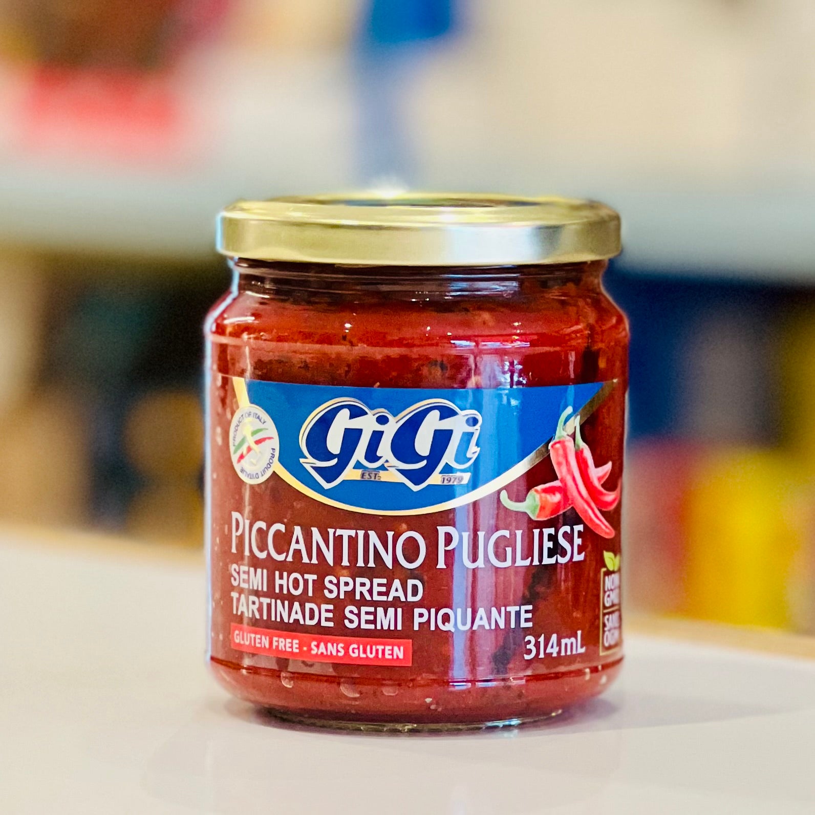 Jar of GiGi Piccantino Pugliese spread on a blurred background