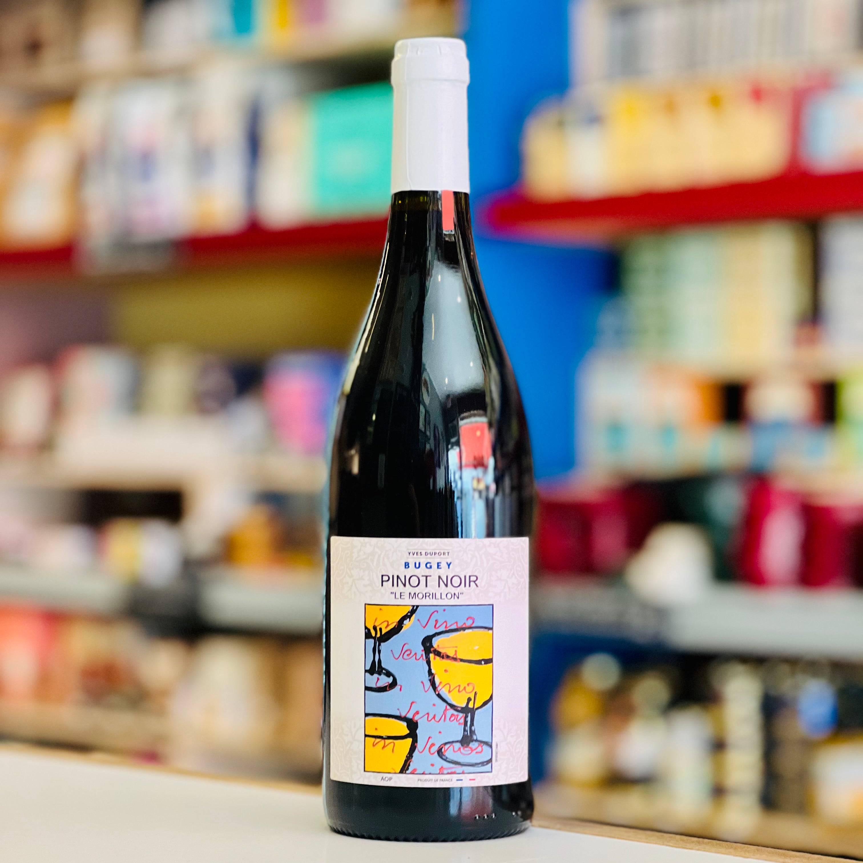 Bottle of Bugey Pinot Noir wine on a shelf in a store