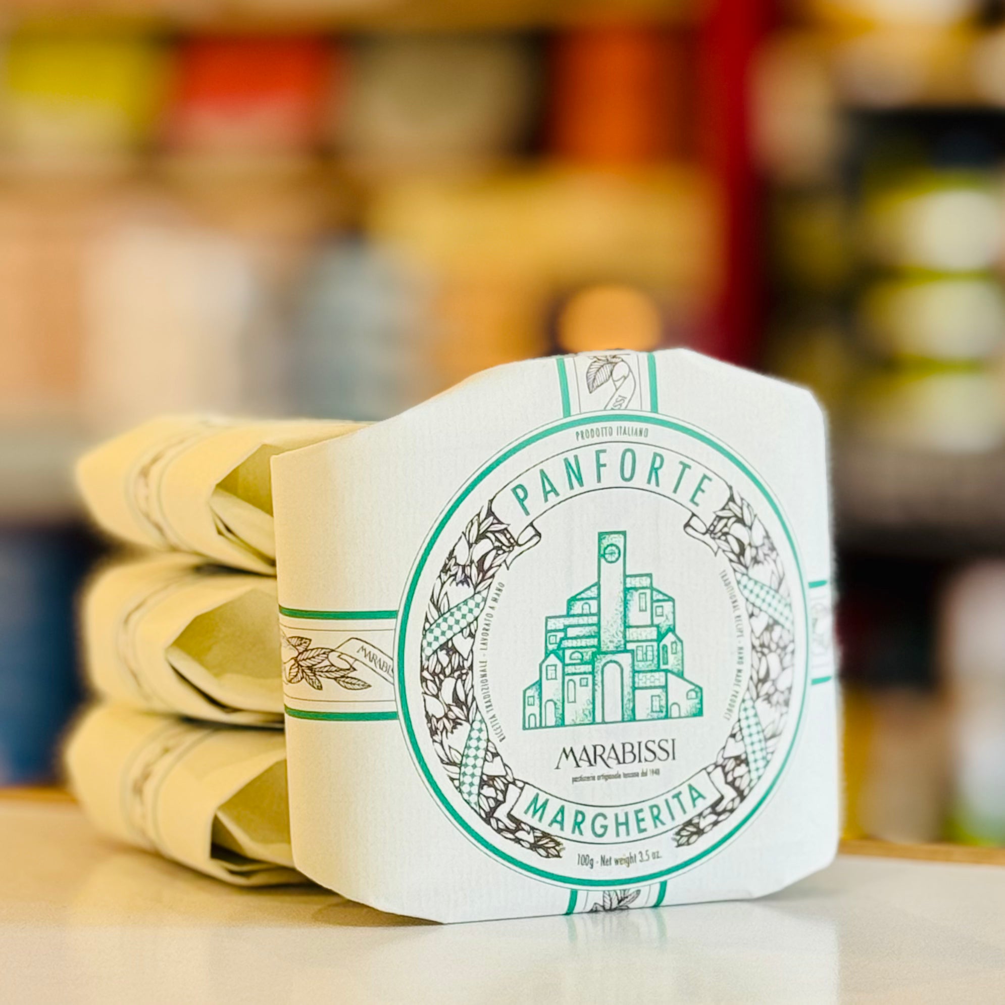 Panforte Margherita packaging with a blurred background