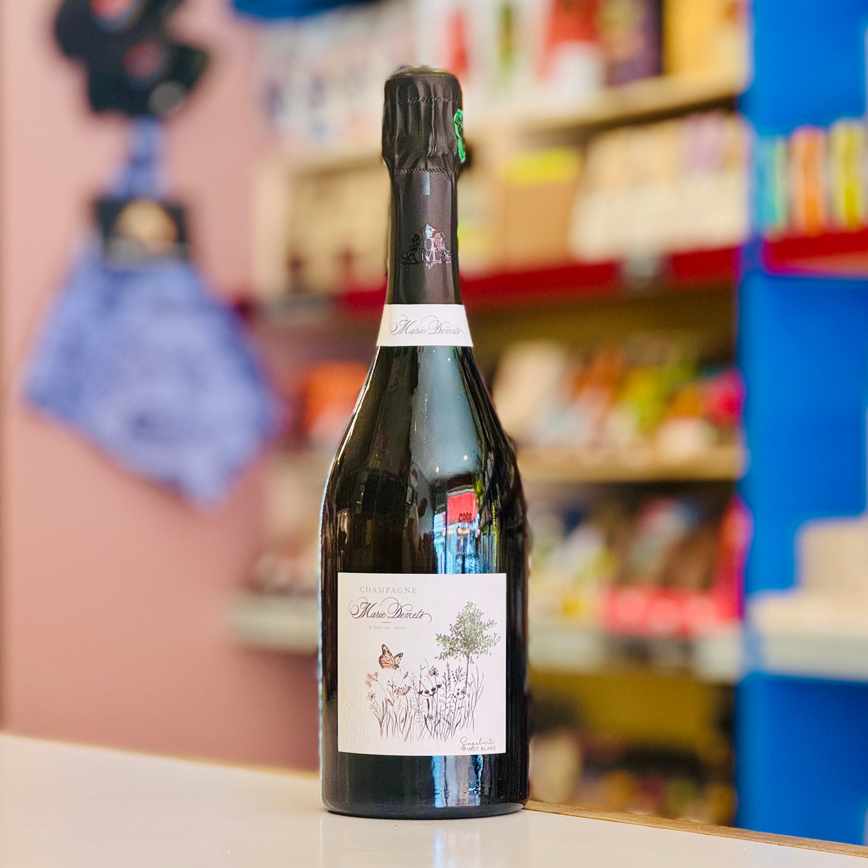 Bottle of wine with a label on a shelf in a store
