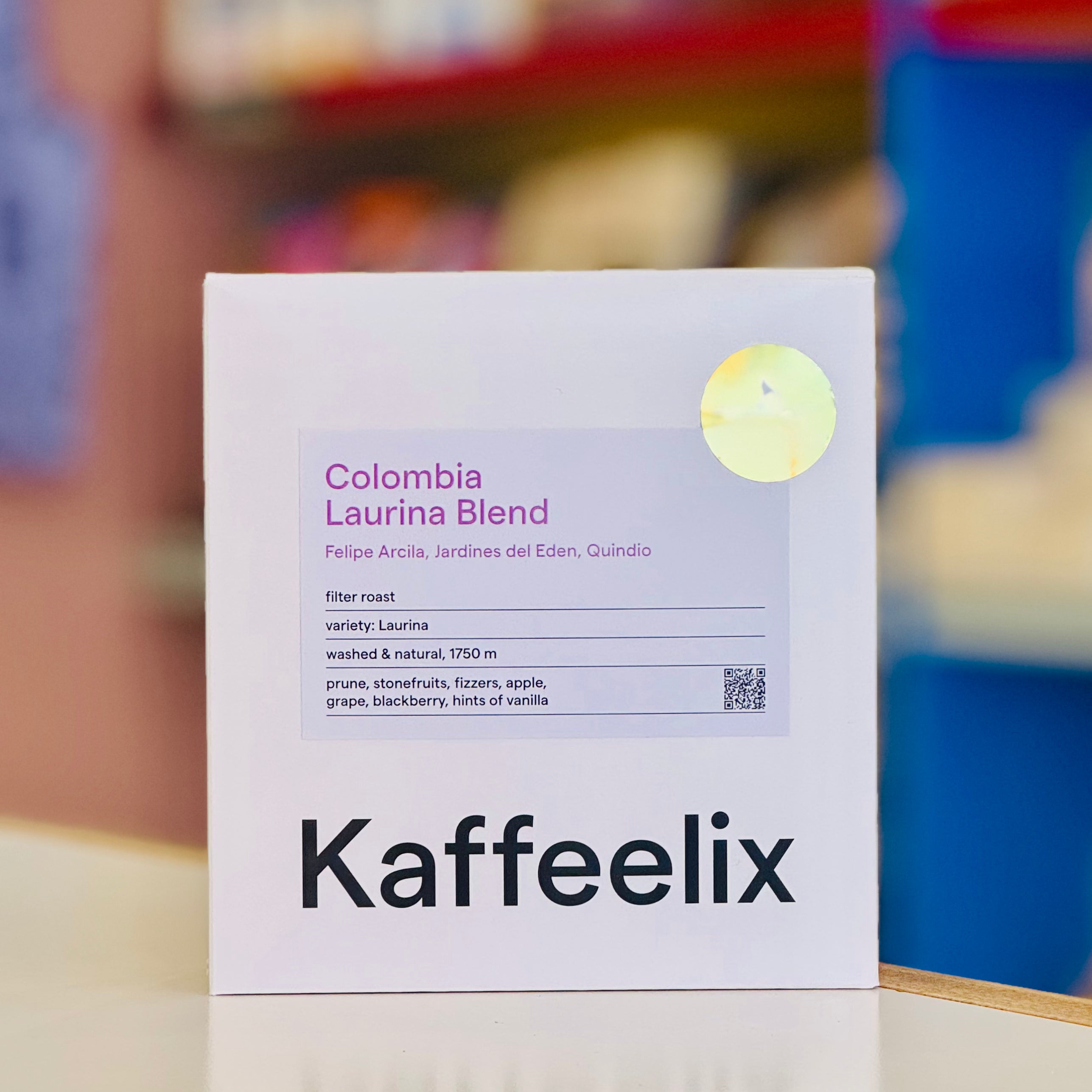 Kaffeelix coffee package with Colombia Laurina Blend label on a blurred background