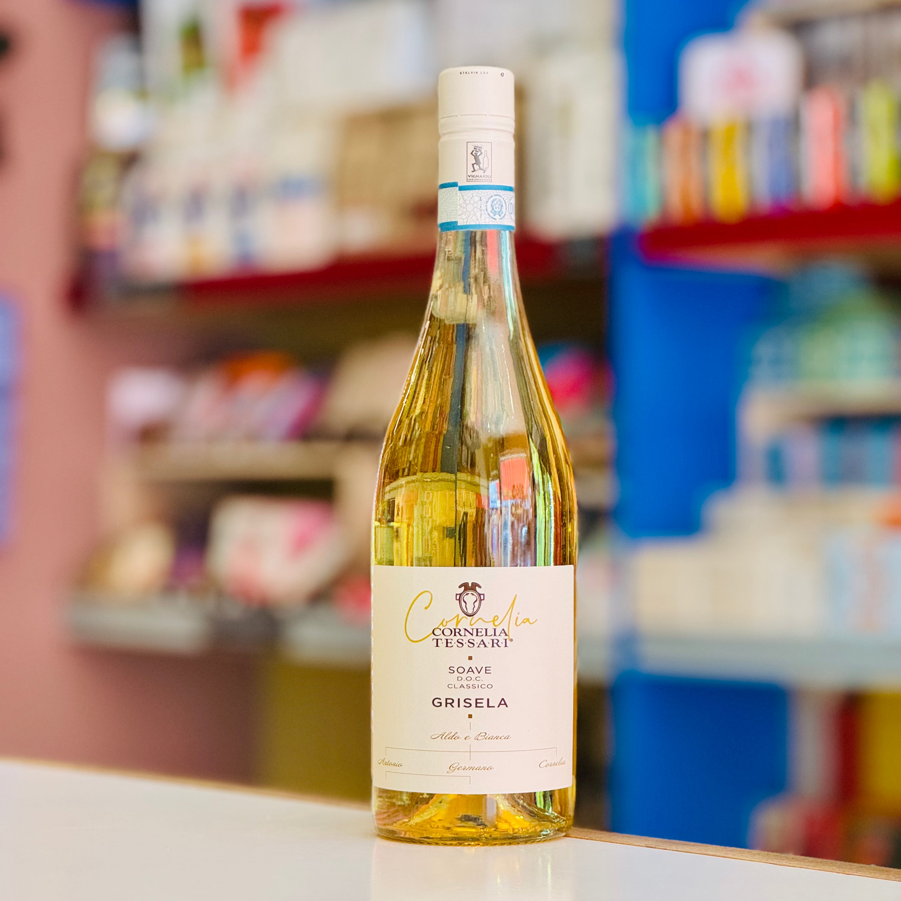 Bottle of Cornelia Grisela wine on a counter with a blurred store shelf in the background