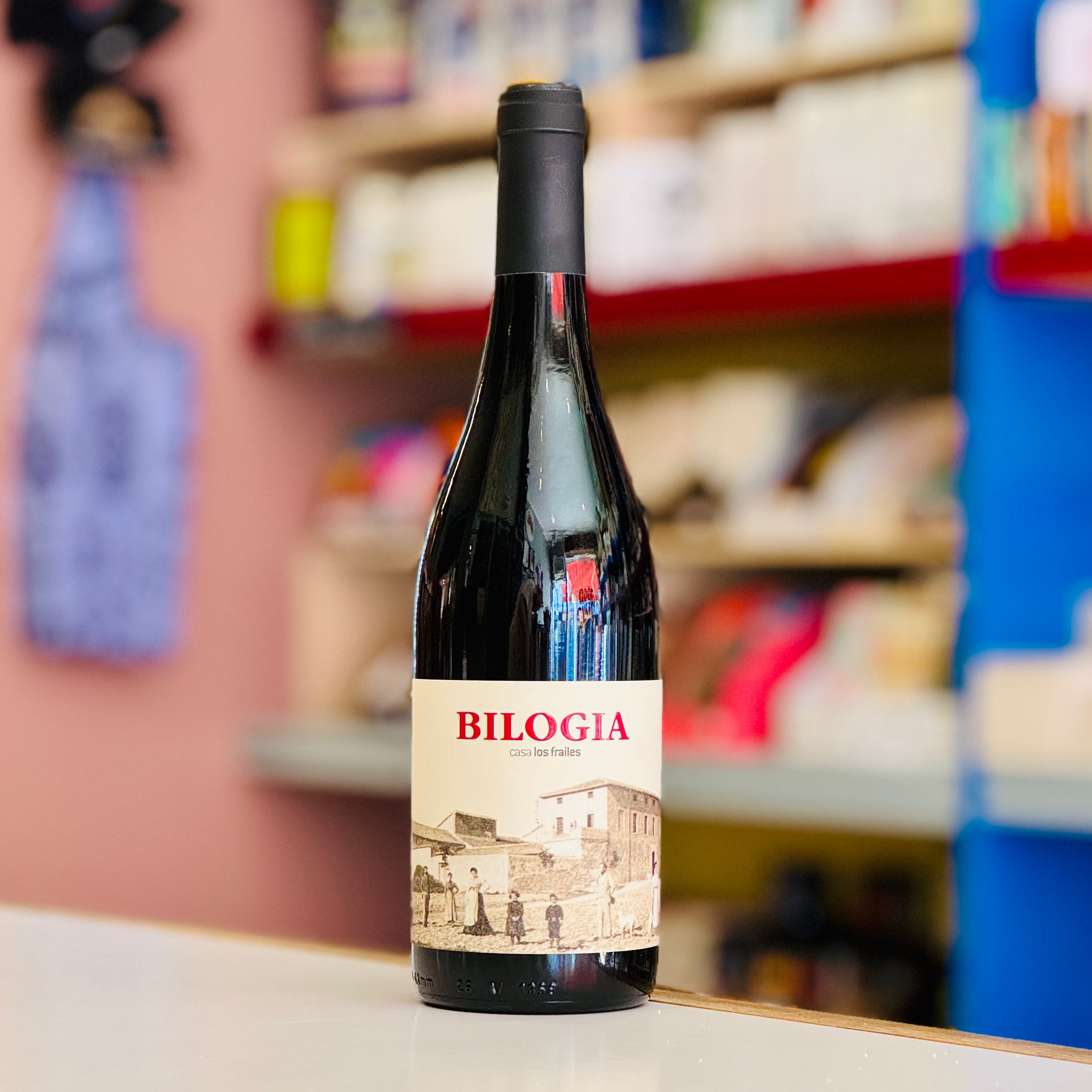 Bottle of Bialogia wine on a shelf with a blurred store background