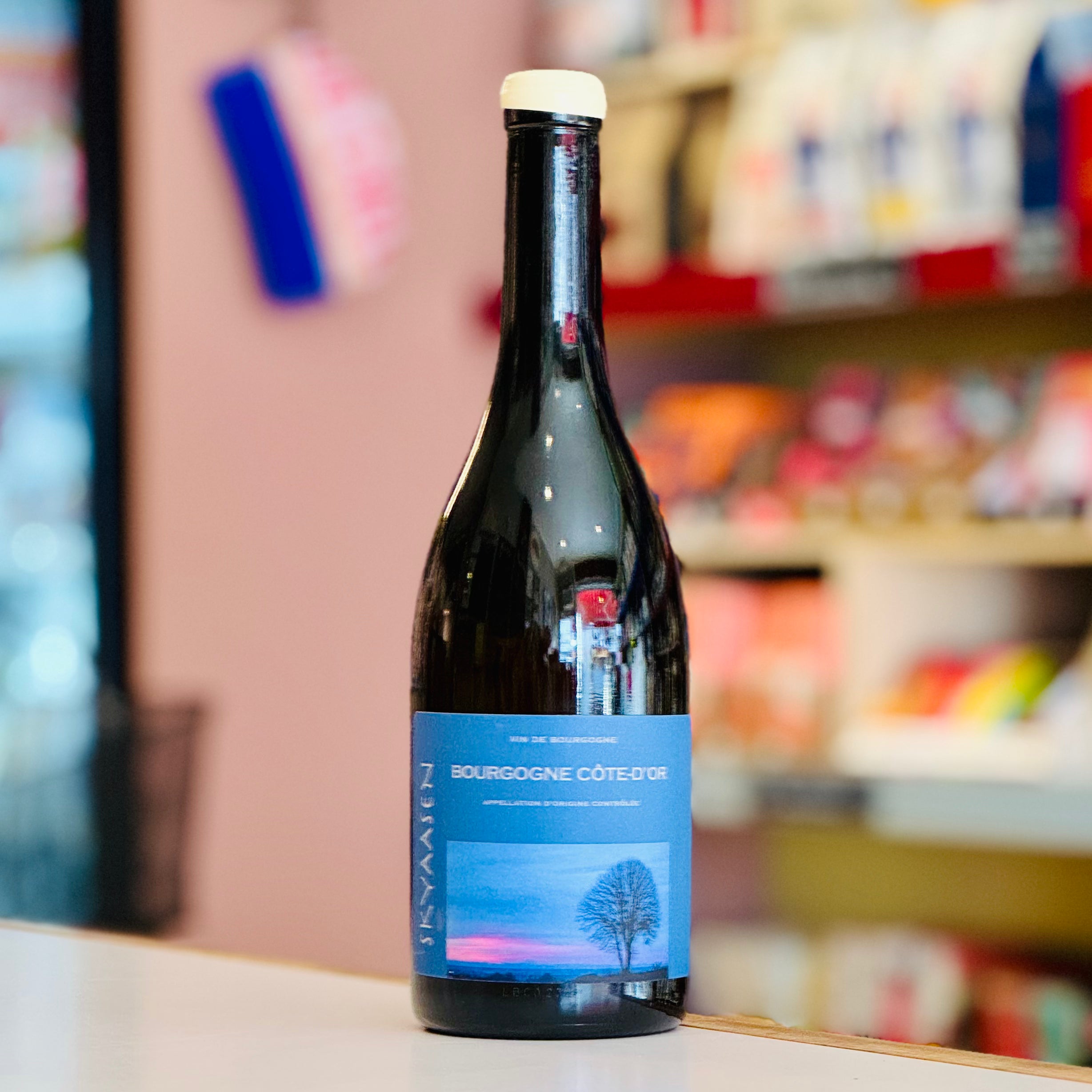 Wine bottle with a blue label on a shelf in a store
