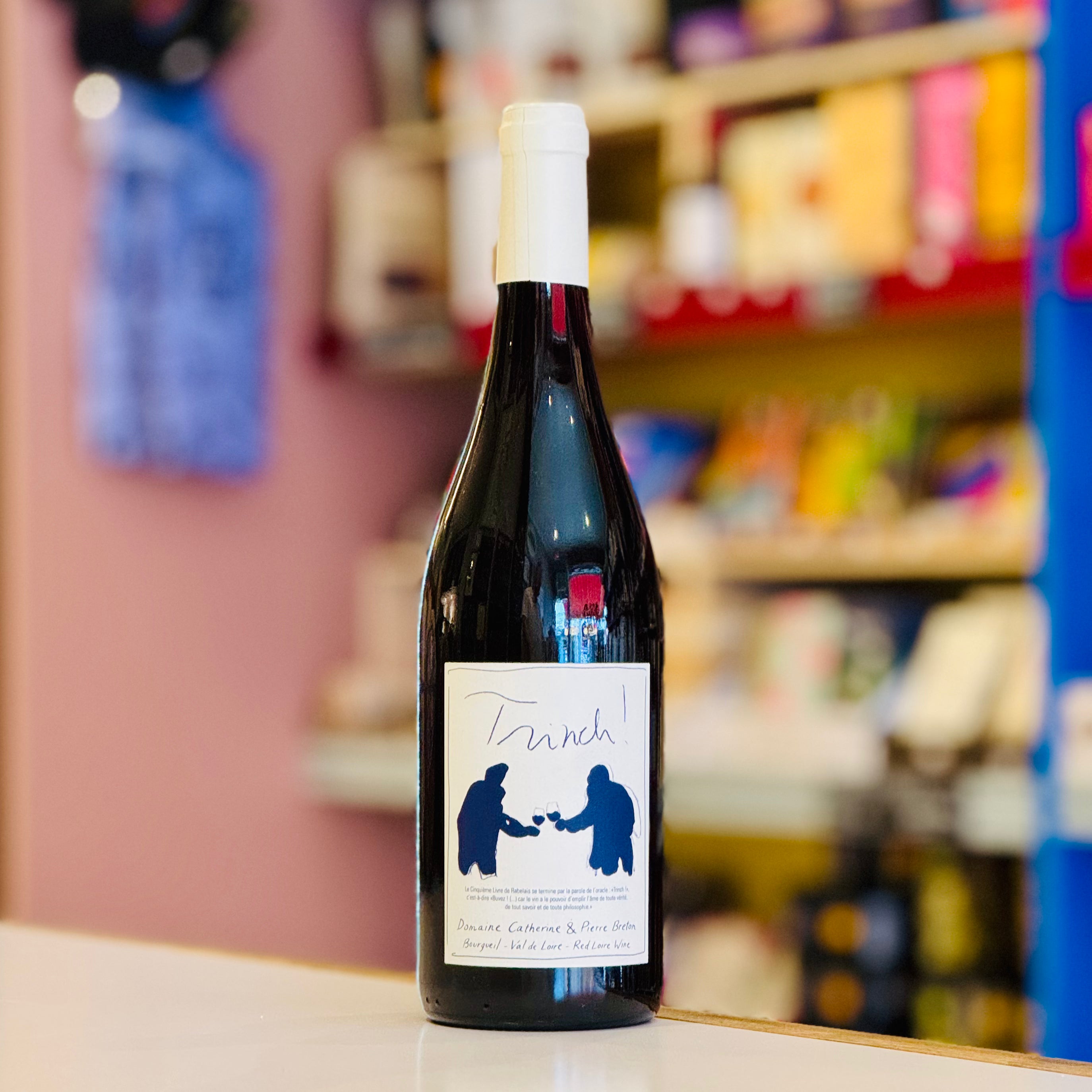Wine bottle with a label on a counter in a store setting