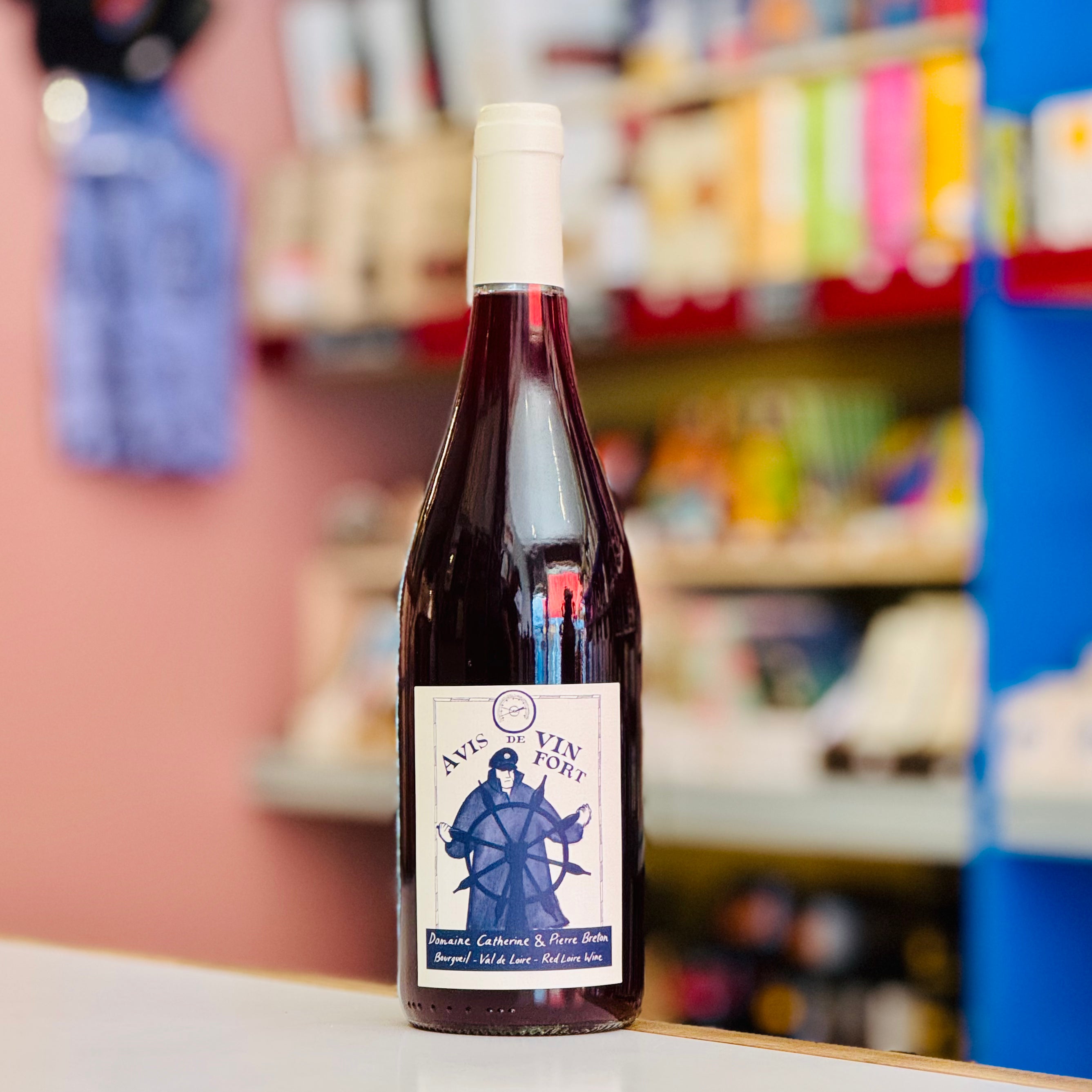 Bottle of wine with a label on a shelf in a store