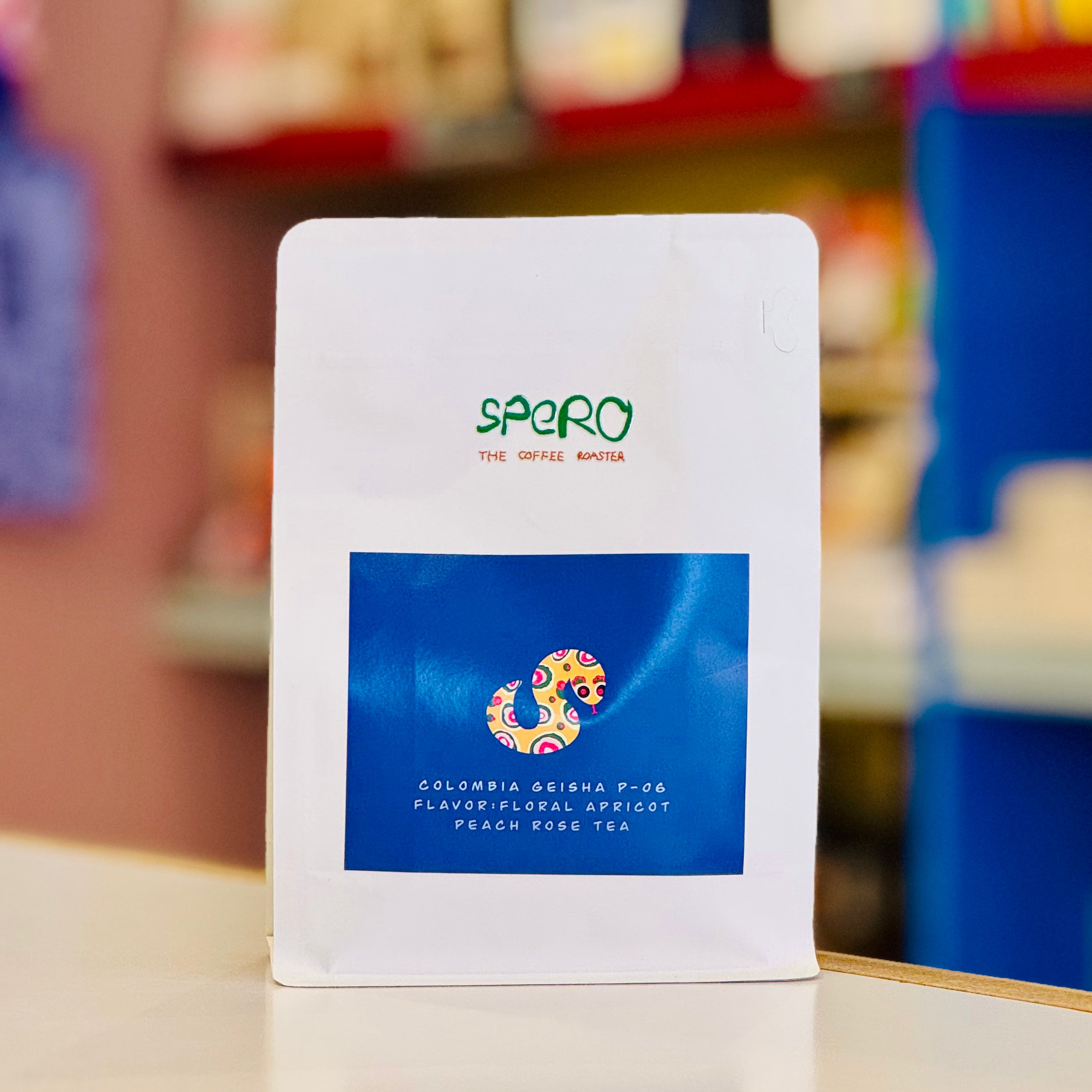 Spgeo coffee package with a colorful label on a blurred background
