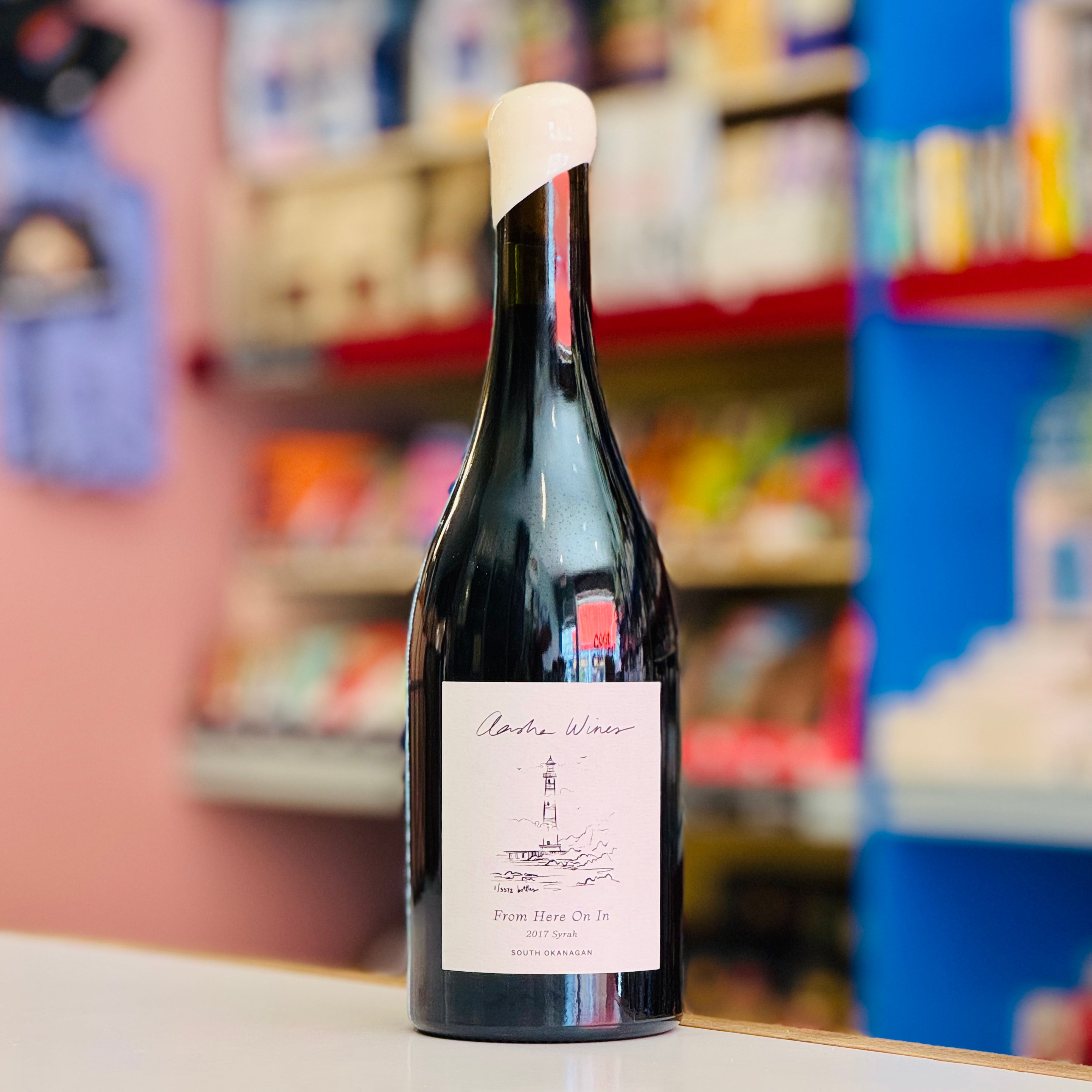 Wine bottle with a label on a shelf in a store