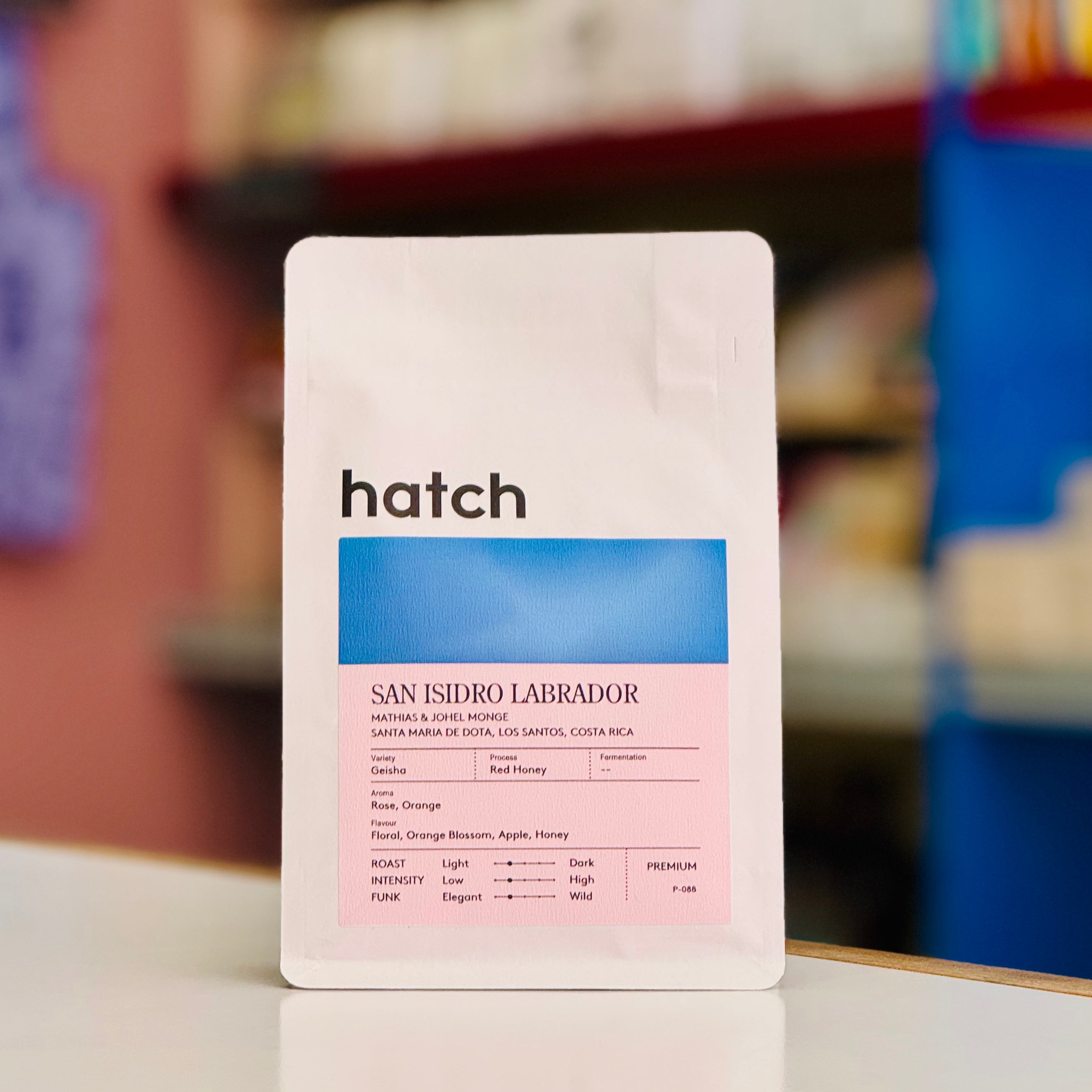 Hatch coffee bag with product details on a blurred background