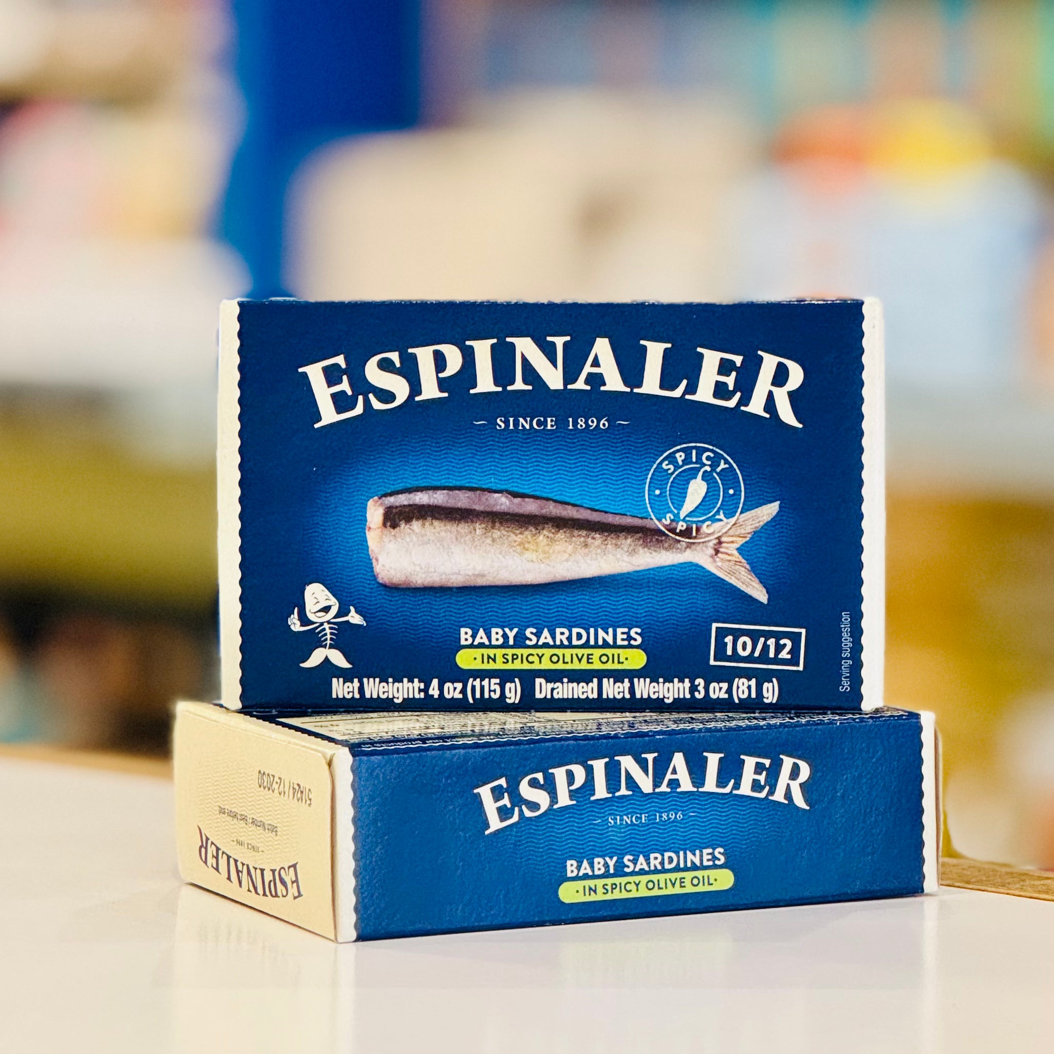 Espinaler baby sardine boxes on a blurred background