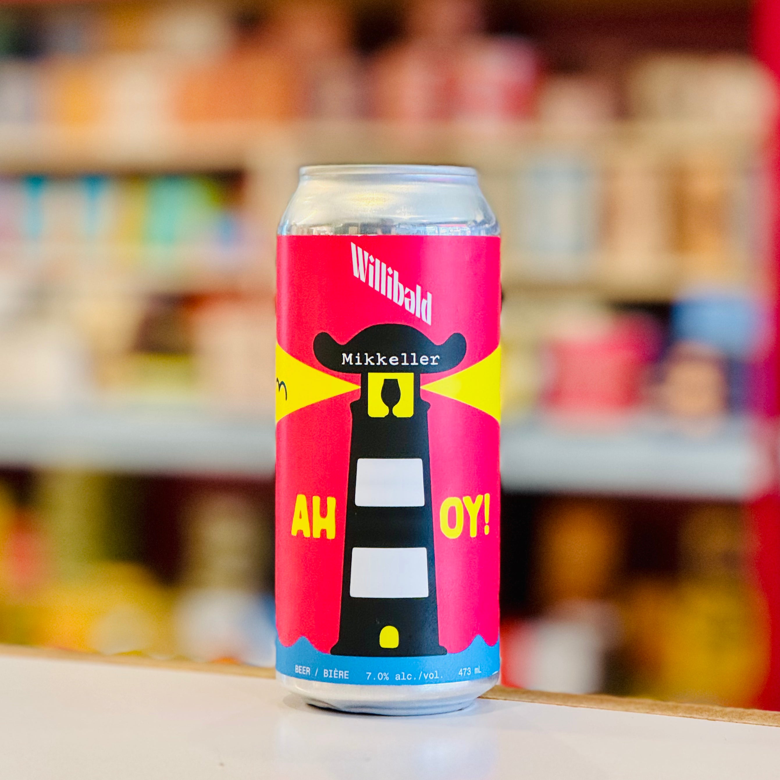 Beer can with colorful design on a shelf in a store