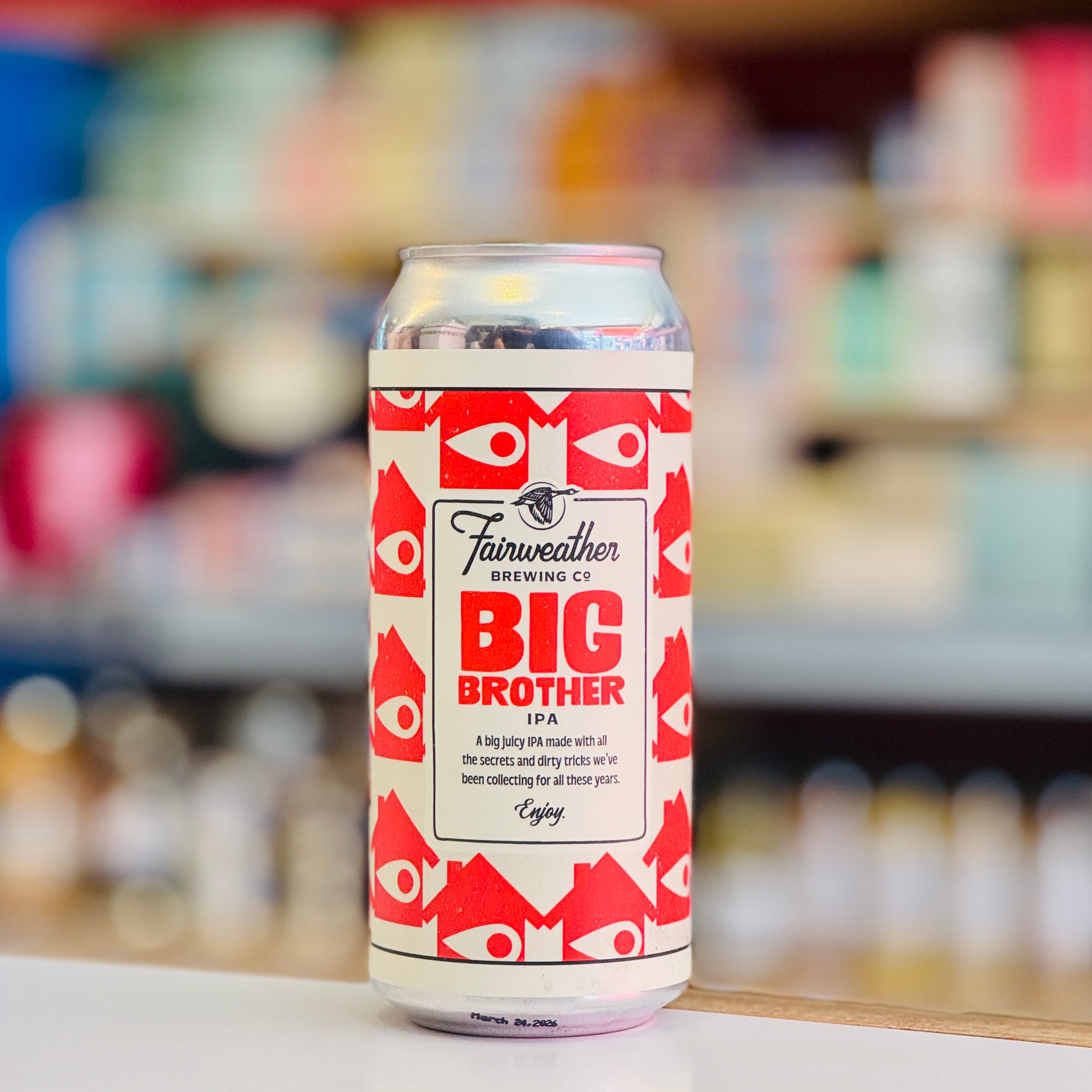 Beer can with 'Big Brother IPA' label by Fairweather Brewing Co. on a blurred store shelf background.