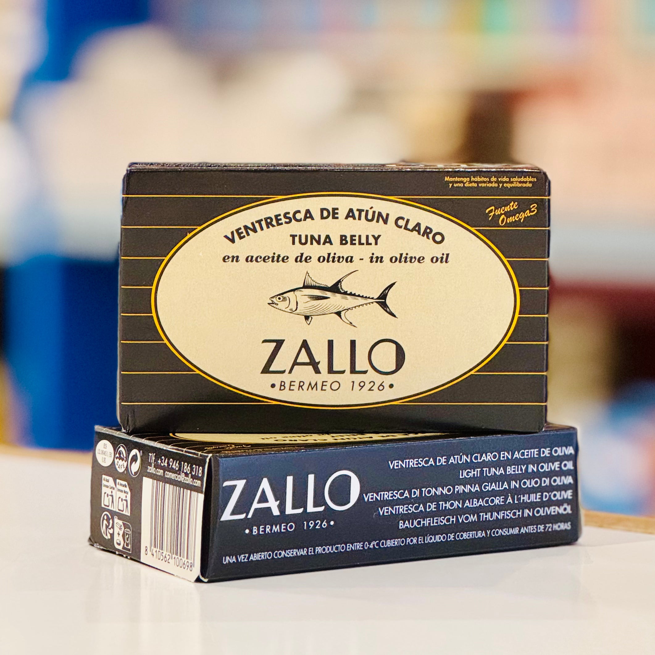 Zallo tuna belly packaging on a blurred background
