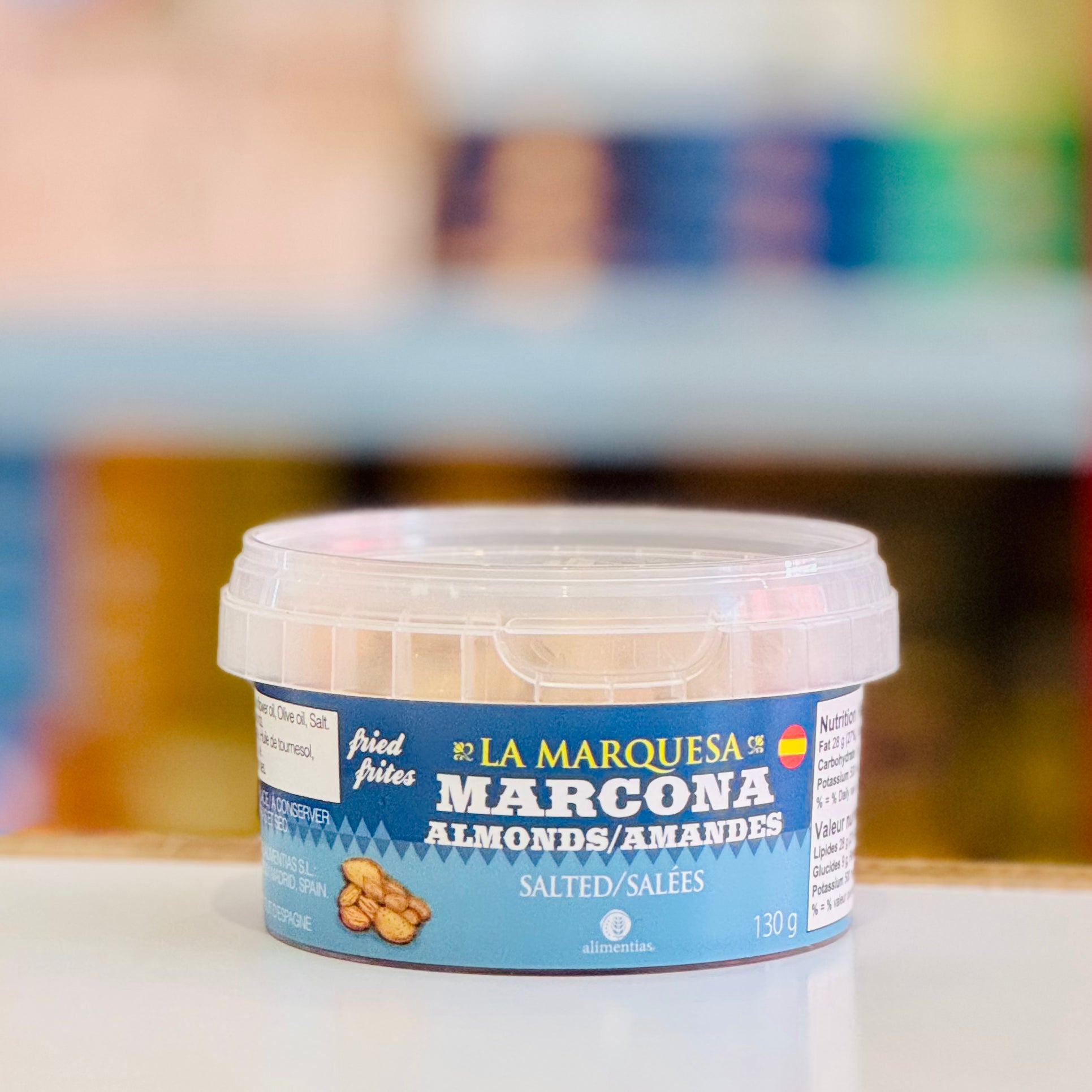 Container of La Marquesa Marcona Almonds on a blurred background