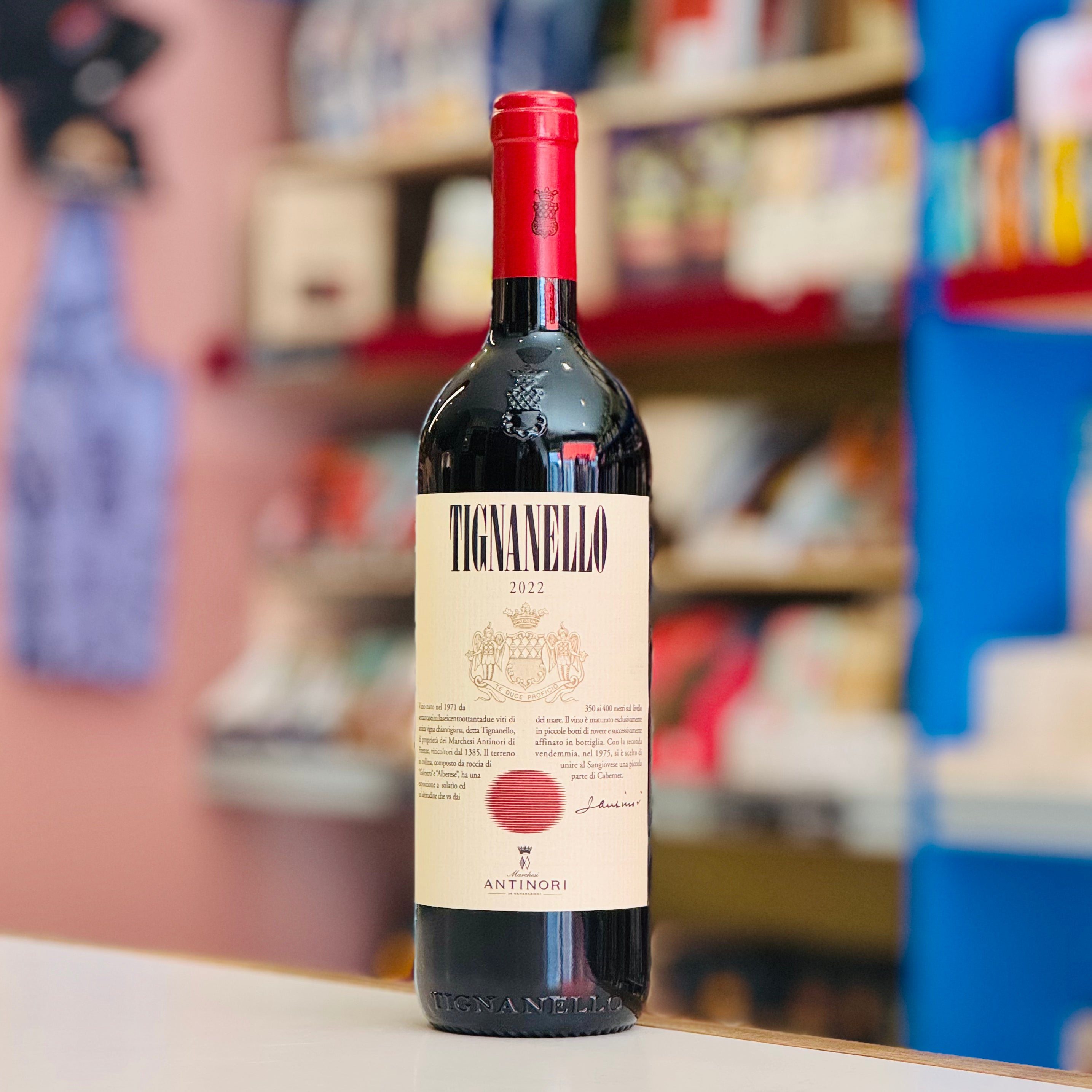Bottle of Tignanello wine with a blurred store shelf in the background