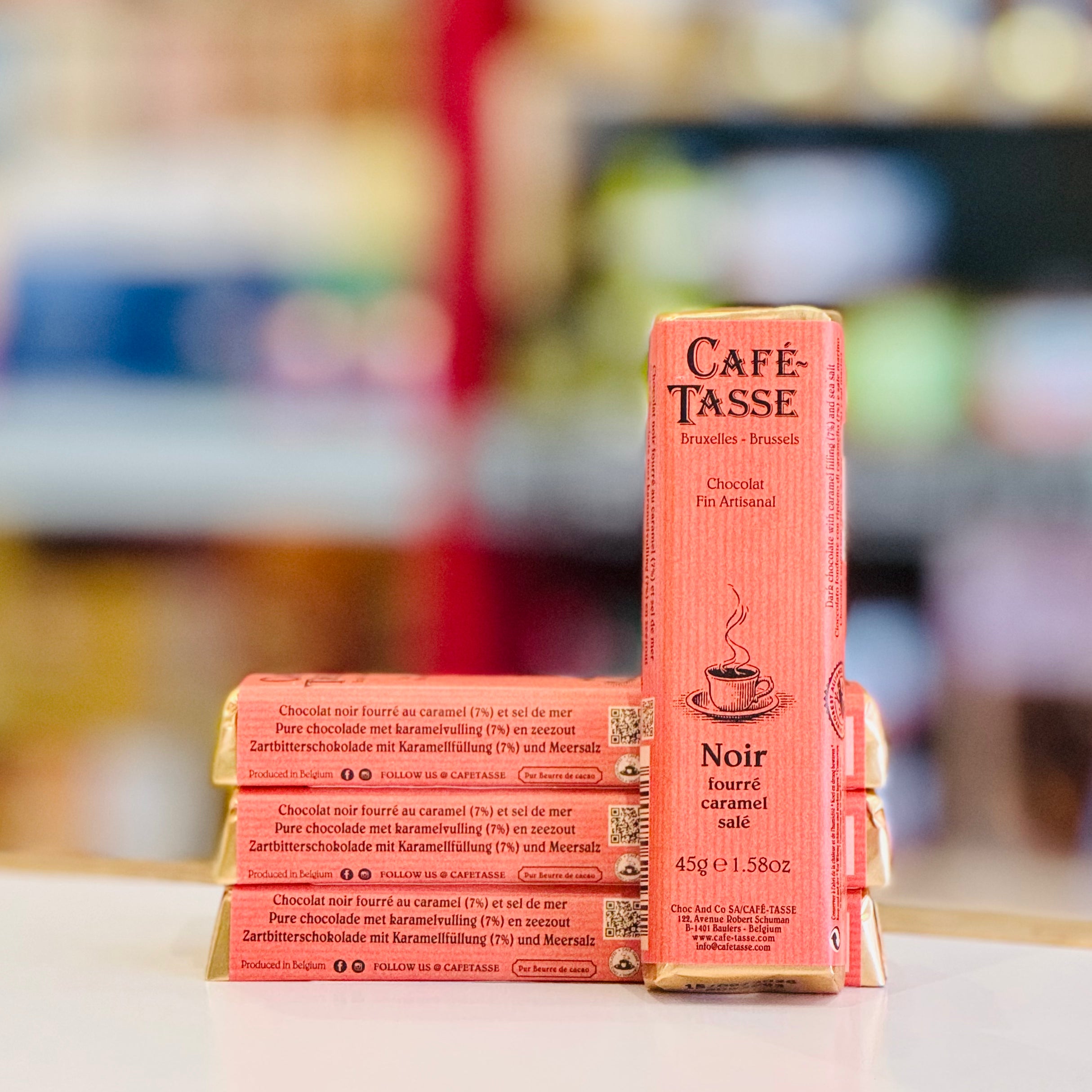 Café Tasse chocolate bars on a table with a blurred background
