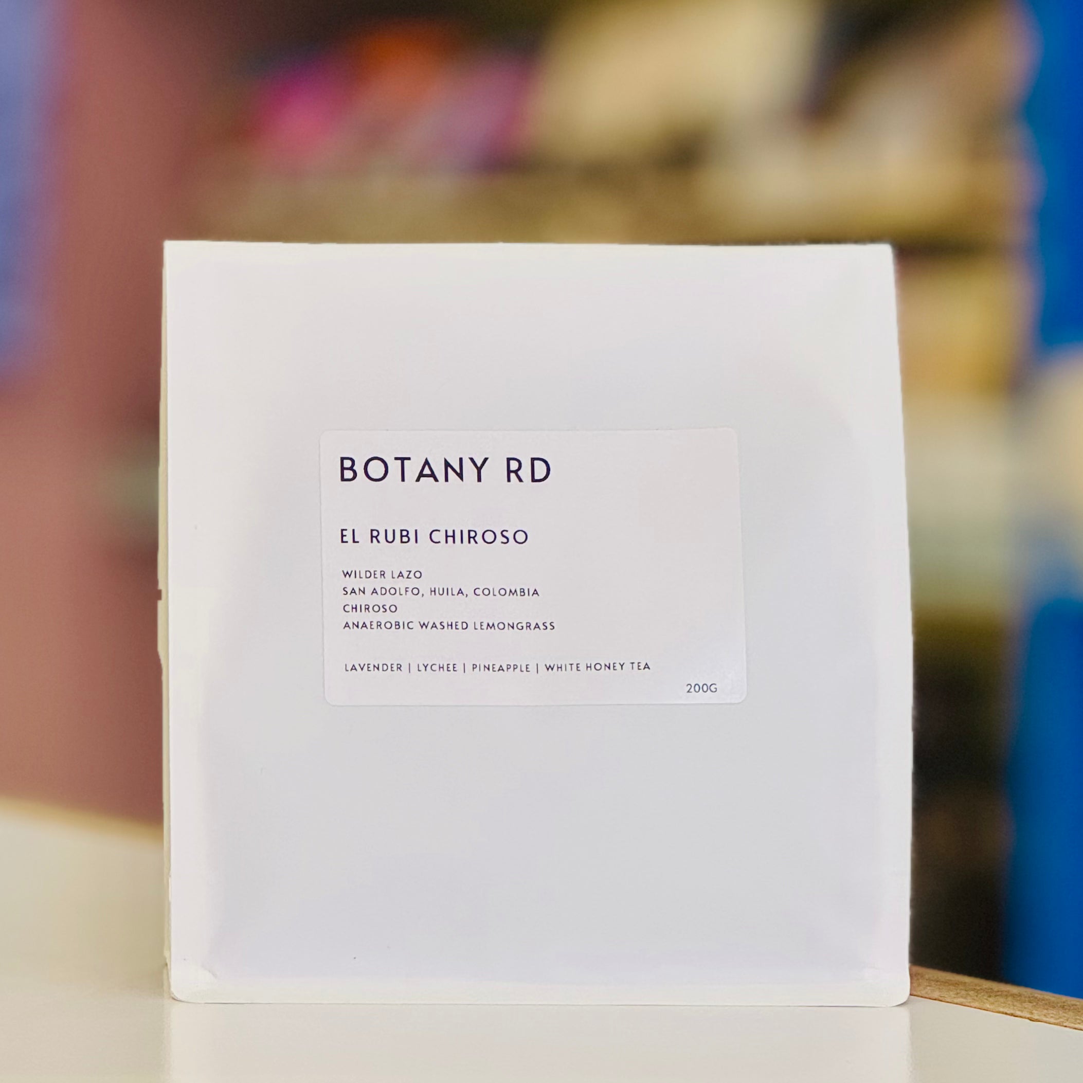 White product packaging with 'BOTANY RD' branding on a blurred background