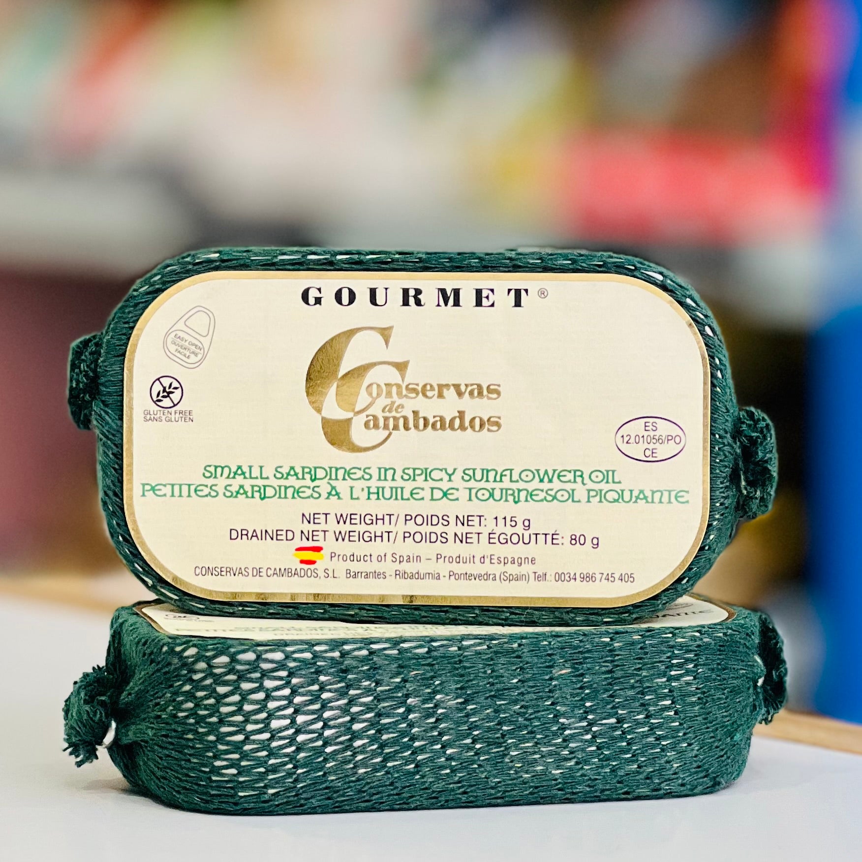 Gourmet canned food packaging with visible branding on a blurred background