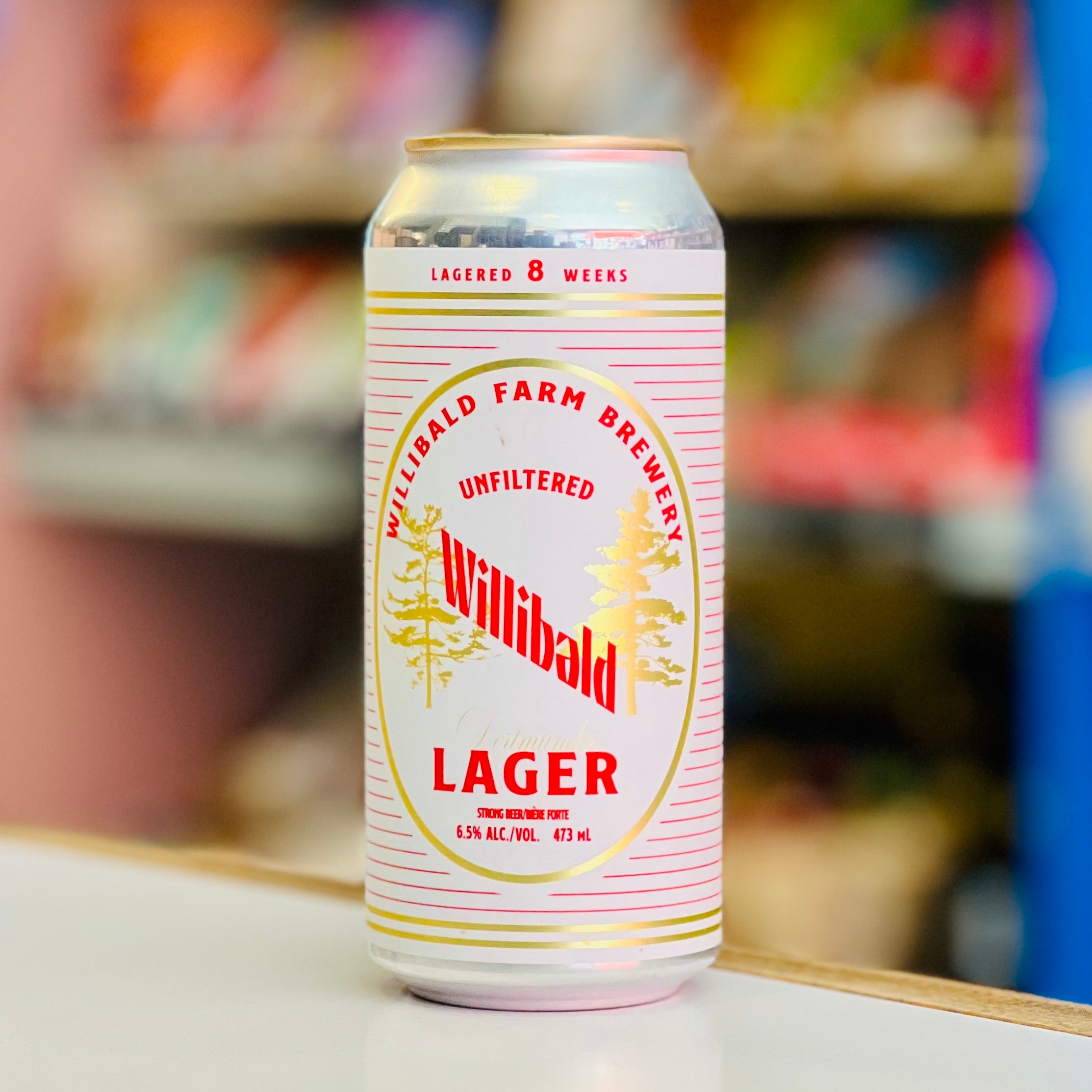 Willibald Lager can on a shelf with a blurred store background