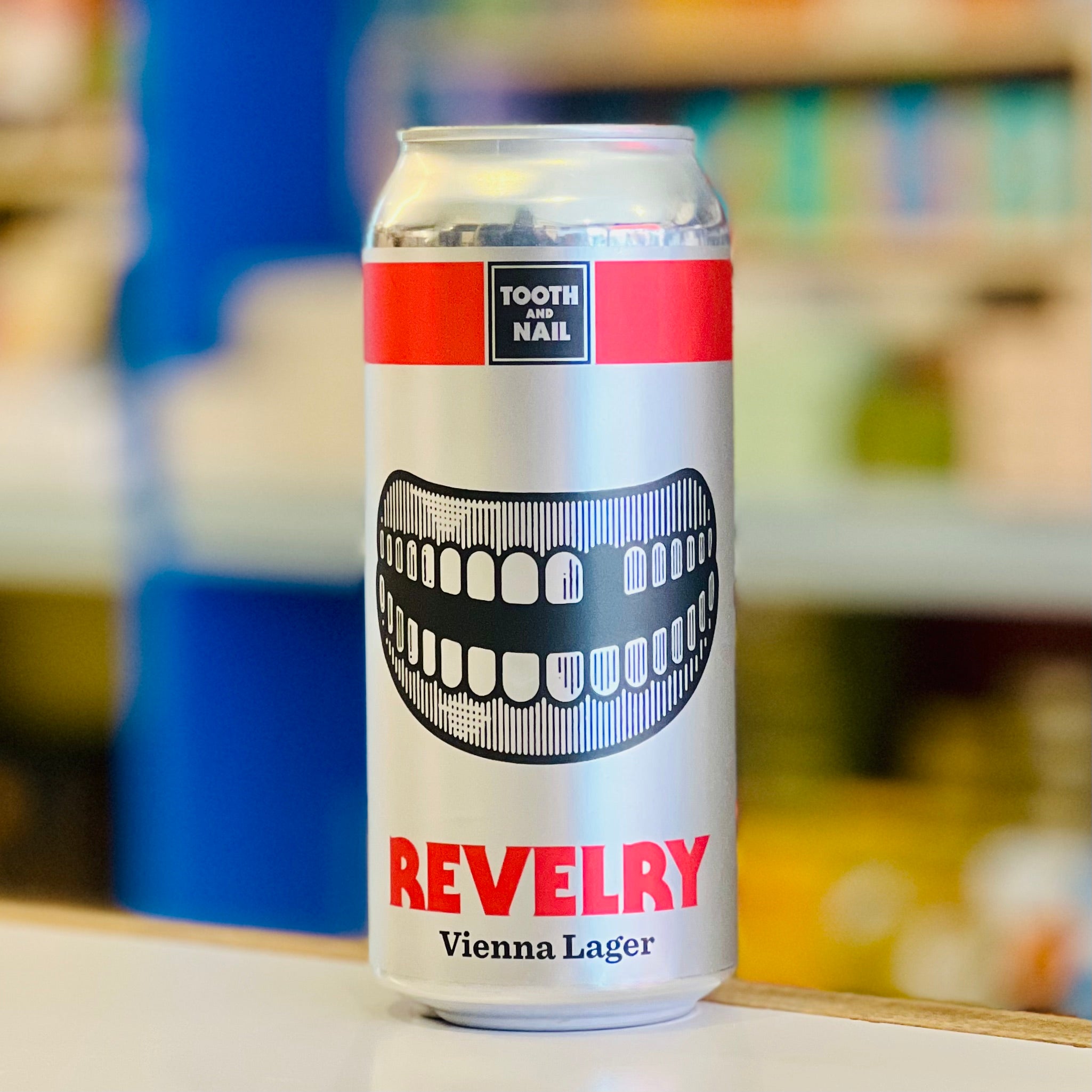 Revelry Vienna Lager can with a blurred background