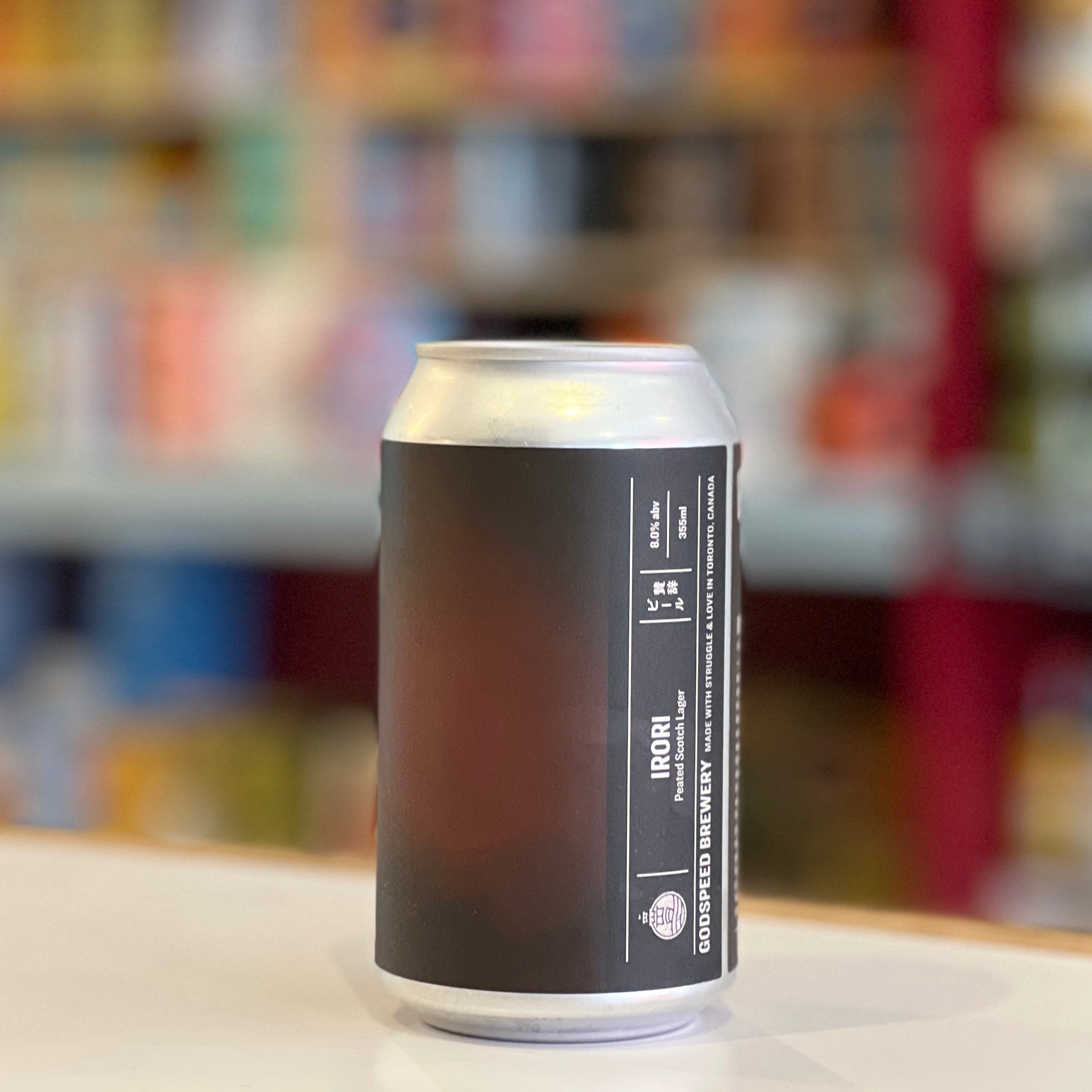 Black can with white label on a counter in a store setting