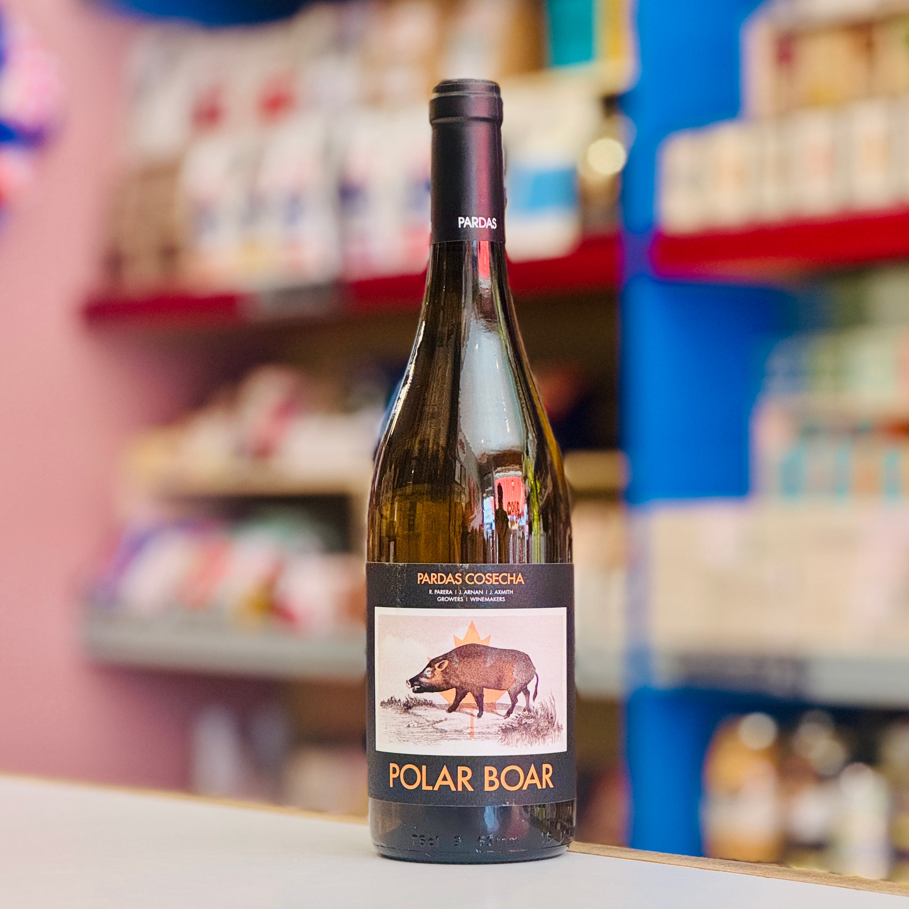 Bottle of Polar Boar wine on a shelf with blurred store shelves in the background