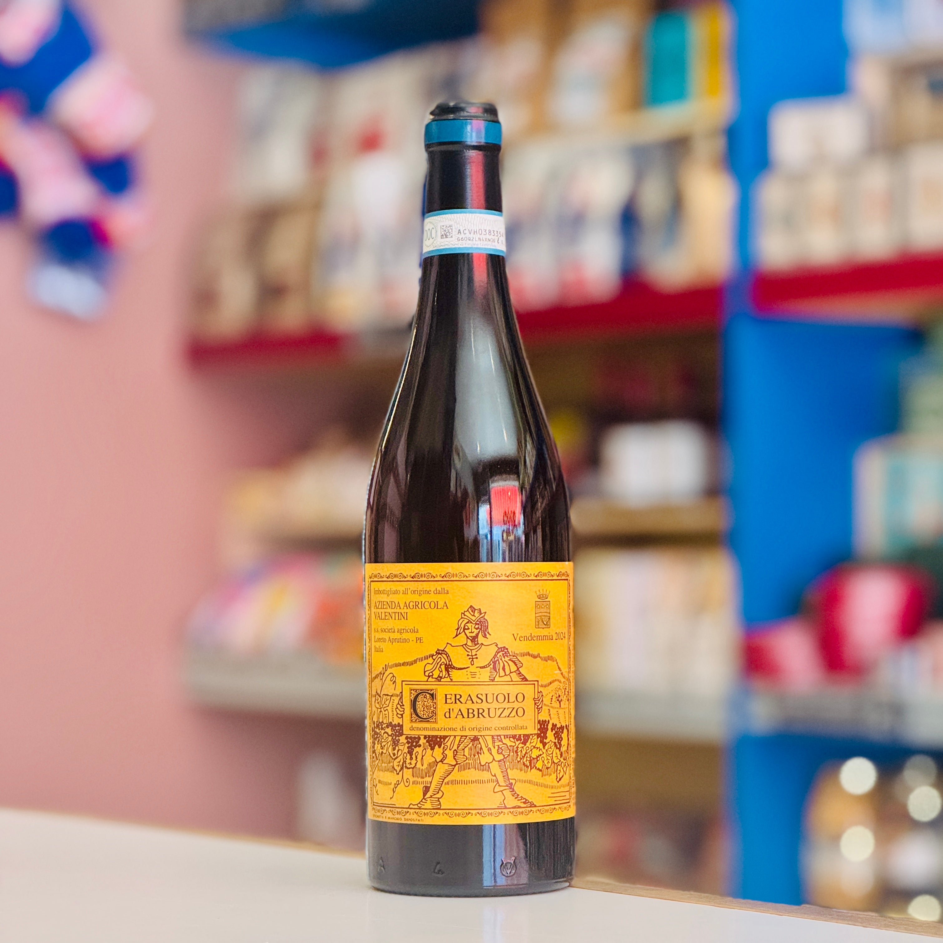 Bottle of Valentini Cerasuolo D'Abruzzo wine on a shelf with blurred store background